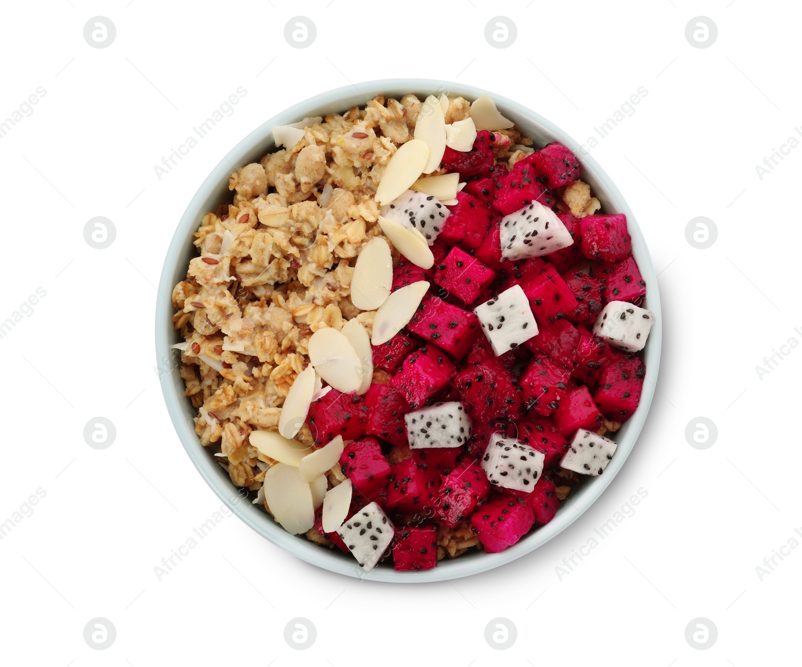 Photo of Bowl of granola with pitahaya and almond petals on white background, top view