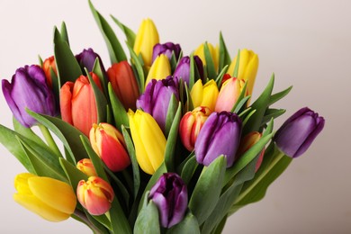 Photo of Bouquet of colorful tulips on white background, closeup