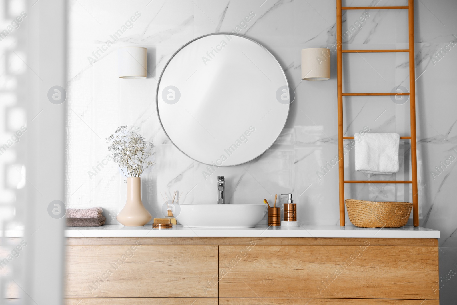 Photo of Modern bathroom interior with stylish mirror and vessel sink