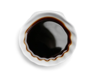 Bowl of soy sauce on white background, top view