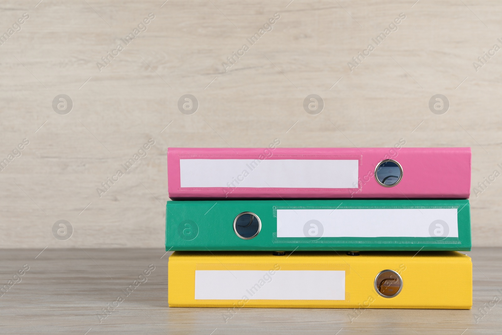 Photo of Stack of office folders on white wooden table