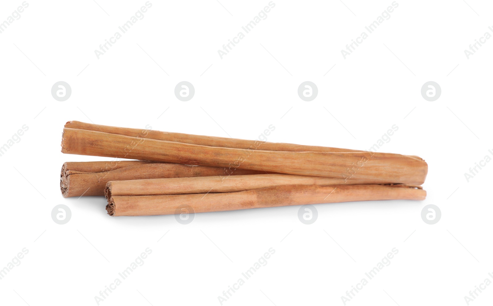 Photo of Aromatic brown cinnamon sticks on white background