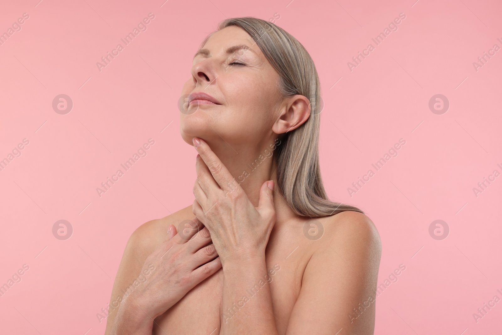 Photo of Beautiful woman with healthy skin on pink background