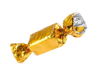 Photo of Tasty candy in golden wrapper isolated on white