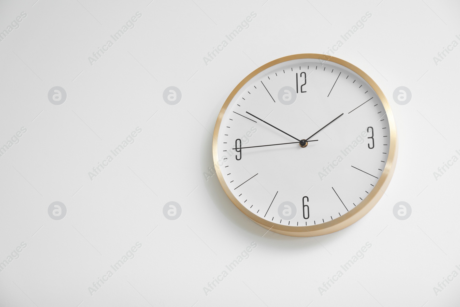 Photo of Stylish clock on white background. Time concept