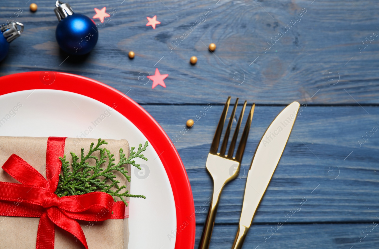 Photo of Beautiful Christmas table setting on blue wooden background, flat lay