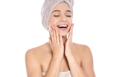 Photo of Portrait of young pretty woman with towels on white background