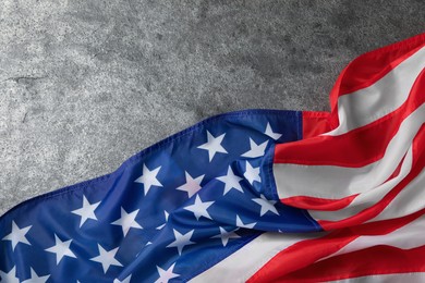 Photo of American flag on grey table, top view with space for text. Memorial Day