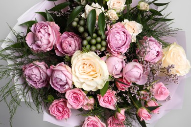 Beautiful bouquet with roses and leaves, closeup