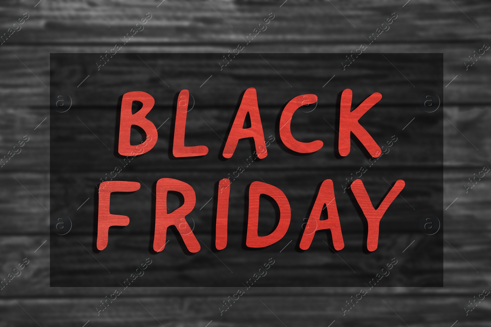Image of Phrase Black Friday and blurred view of wooden surface on background 