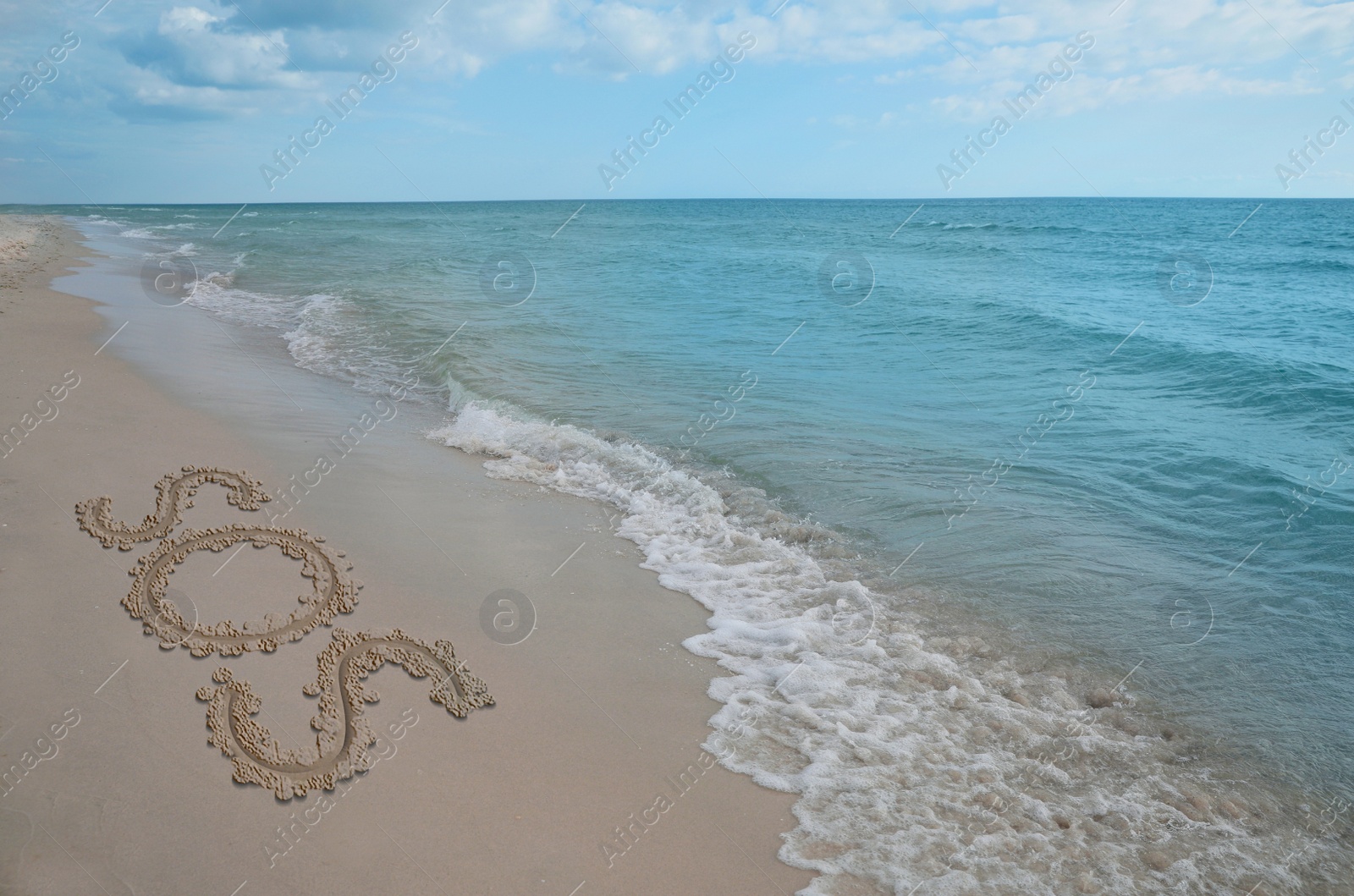 Image of SOS message drawn on sandy beach near sea