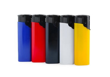 Photo of Stylish small pocket lighters on white background