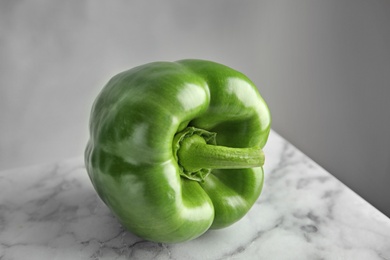 Photo of Raw ripe paprika pepper on table, closeup