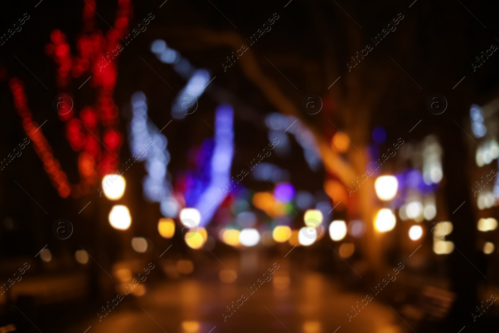 Photo of Beautiful street lights at night. Bokeh effect