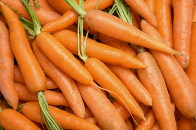 Ripe carrots as background, top view. Healthy diet