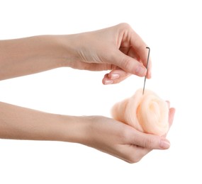 Photo of Woman needle felting from wool on white background, closeup