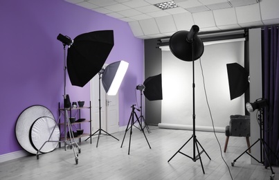 Interior of modern photo studio with professional equipment