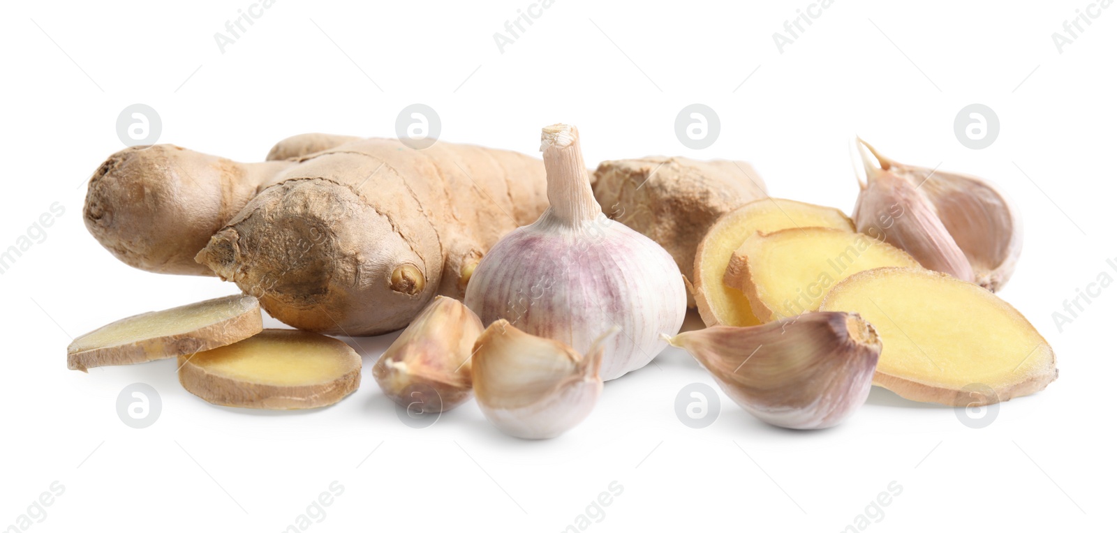 Photo of Fresh garlic and other natural cold remedies isolated on white