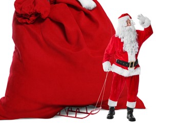 Image of Santa Claus with big red bag full of Christmas presents on sled against white background