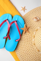 Flat lay composition with beach accessories on white background