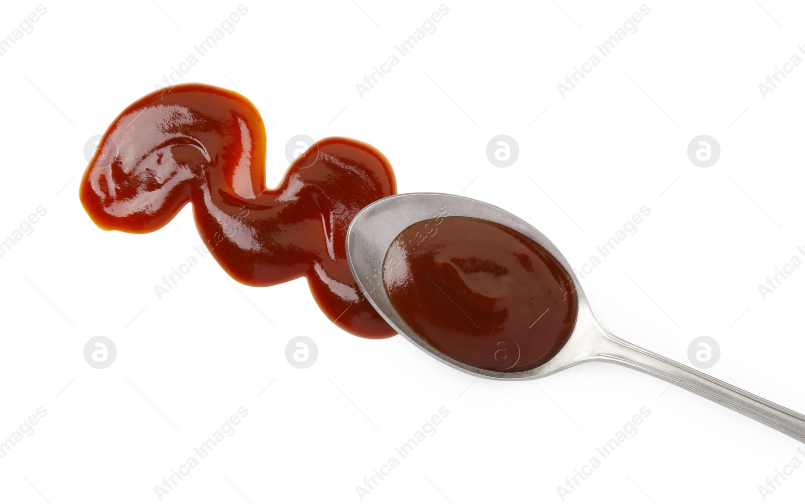 Photo of Tasty barbecue sauce and spoon isolated on white, top view