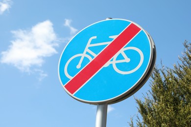Traffic sign End Of Cycleway against blue sky, low angle view