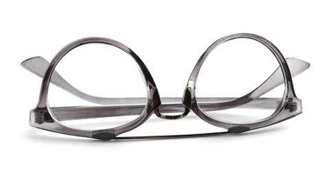 Photo of Glasses with corrective lenses on white background. Vision problem