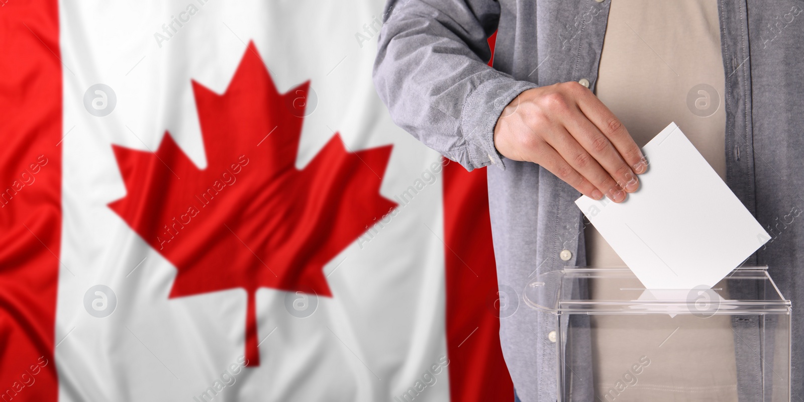 Image of Man putting his vote into ballot box against national flag of Canada, closeup. Banner design with space for text