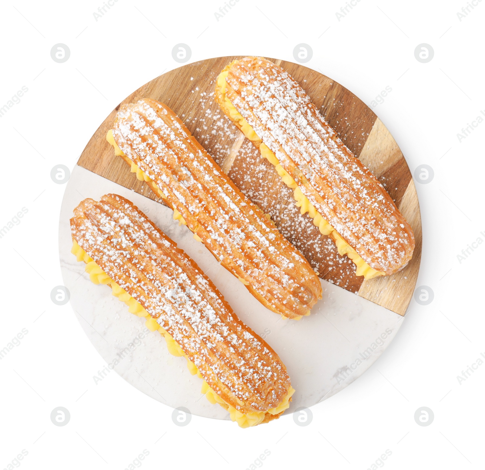 Photo of Delicious eclairs filled with cream isolated on white, top view