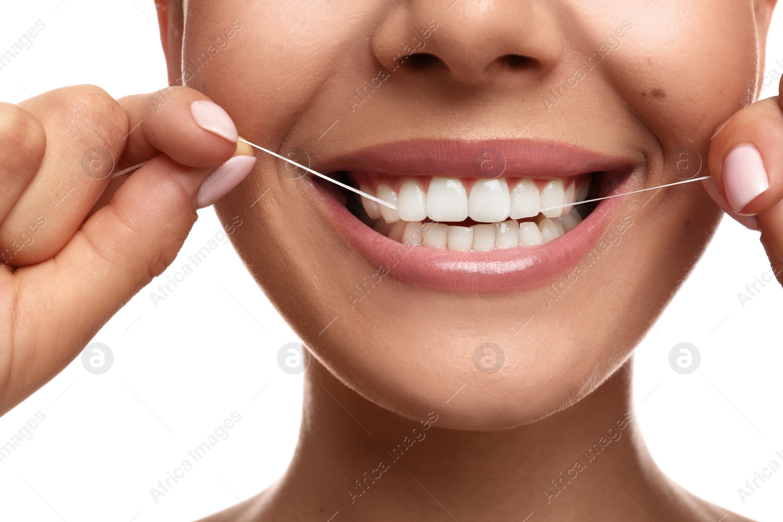 Photo of Young woman flossing her teeth on white background, closeup. Cosmetic dentistry