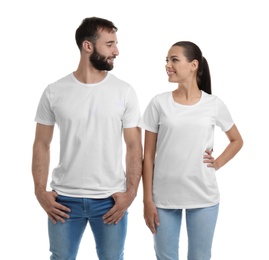 Young couple in t-shirts on white background. Mockup for design