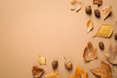 Photo of Flat lay composition with autumn leaves on brown background. Space for text