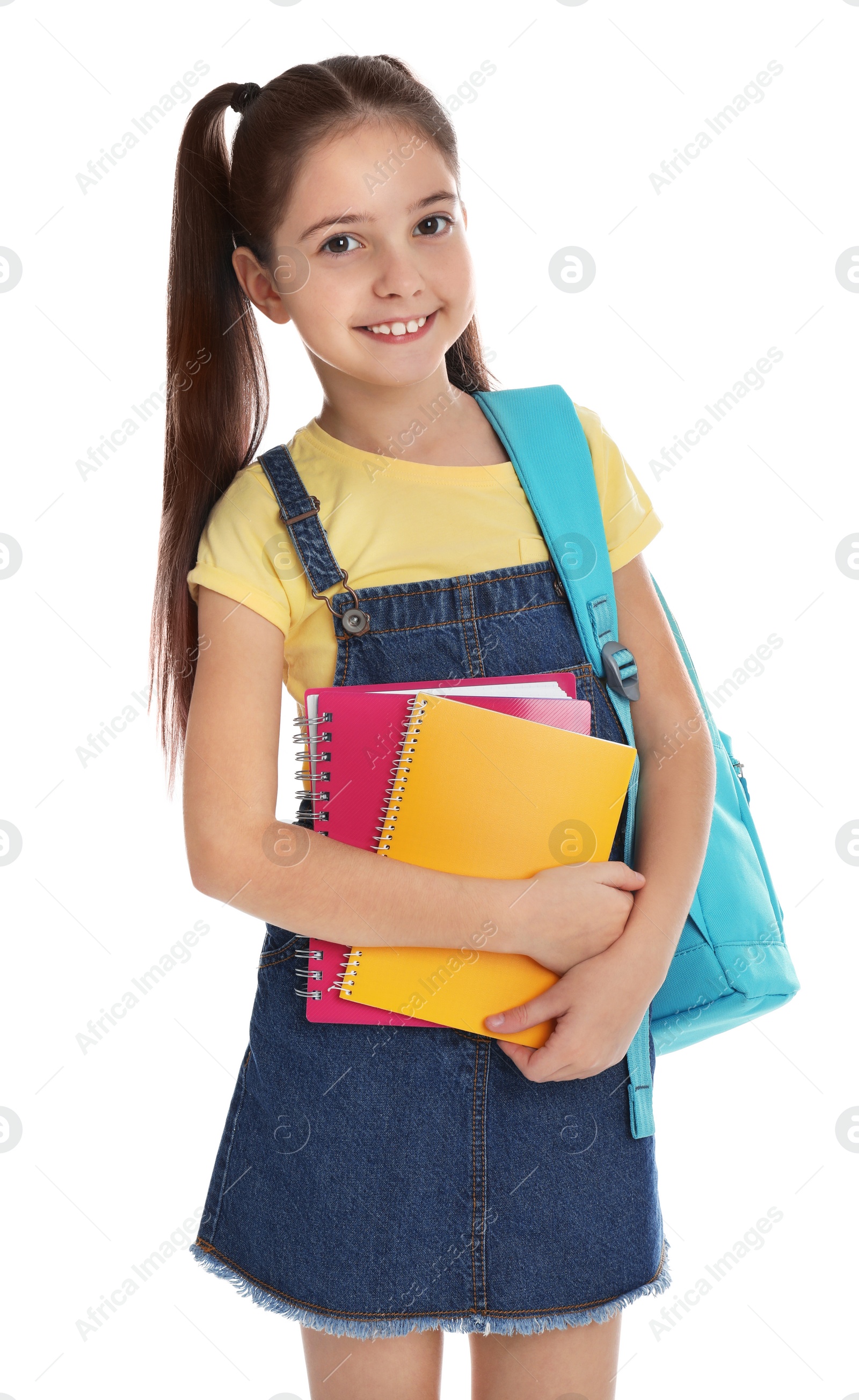 Photo of Little girl with school stationery on white background
