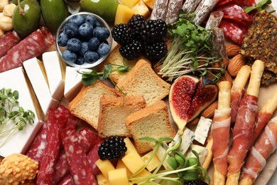 Photo of Different tasty appetizers as background, top view