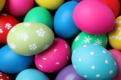 Photo of Colorful eggs as background, closeup. Happy Easter