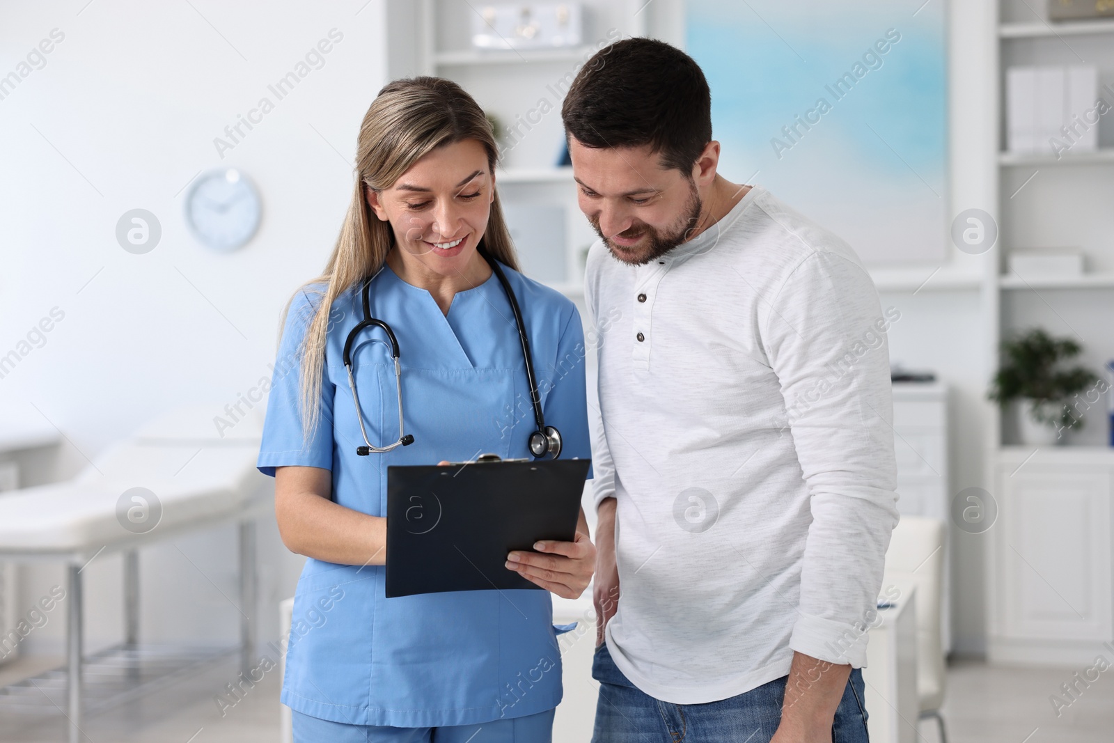 Photo of Professional doctor working with patient in hospital