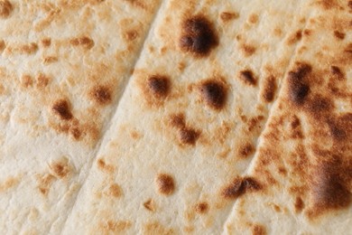 Photo of Texture of tasty tortillas as background, top view