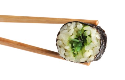 Chopsticks with tasty fresh sushi roll isolated on white