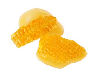 Photo of Pieces of natural honeycomb with tasty honey isolated on white, top view