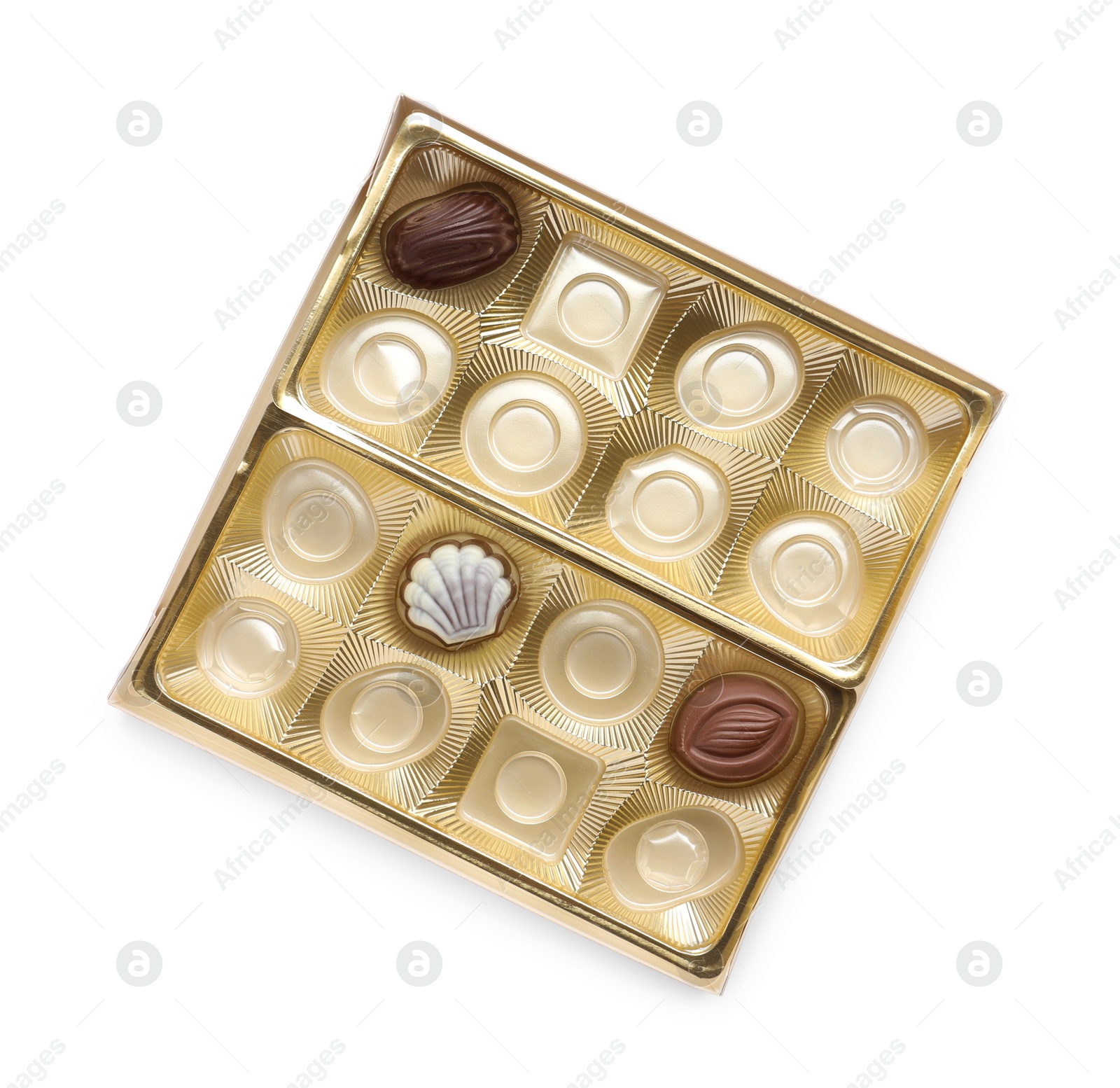 Photo of Partially empty box of chocolate candies isolated on white, top view