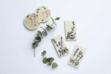 Composition with scented sachets on white background, top view