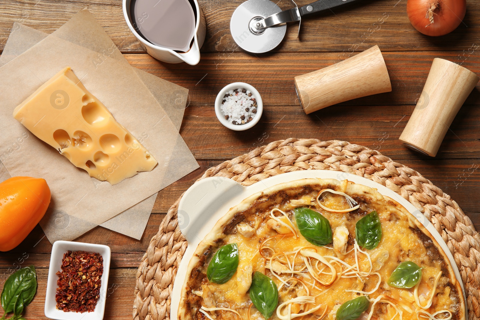 Photo of Flat lay composition with delicious homemade pizza on wooden background