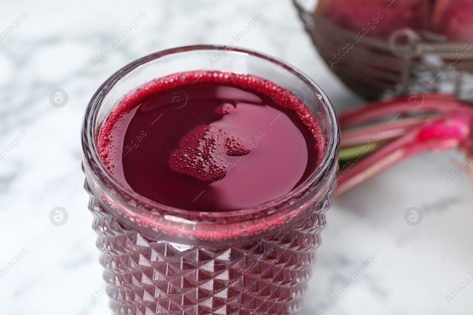 Photo of Glass with fresh beet juice, closeup