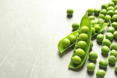 Photo of Fresh green peas on light background, closeup