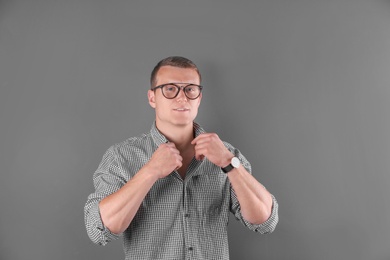 Handsome young man on color background