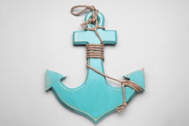 Wooden anchor figure on light background, top view