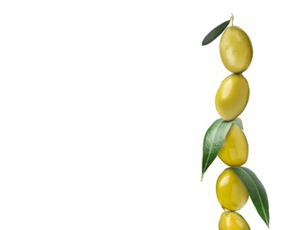 Image of Stack of whole green olives with leaves on white background