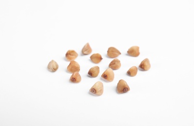 Photo of Uncooked buckwheat on white background. Healthy diet