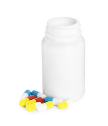 Antibiotic pills and bottle isolated on white