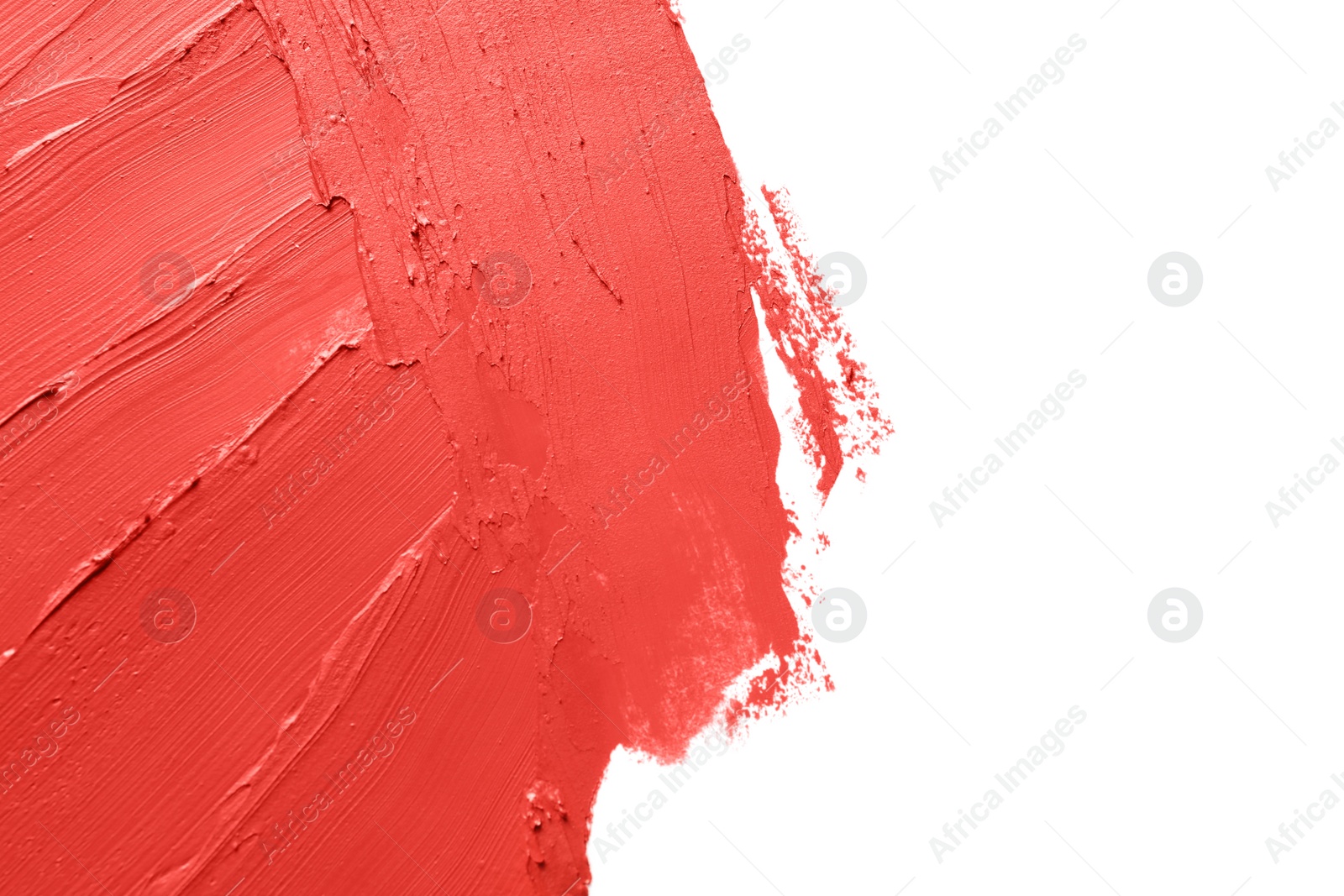 Photo of Red lipstick smears on white background, closeup. Space for text